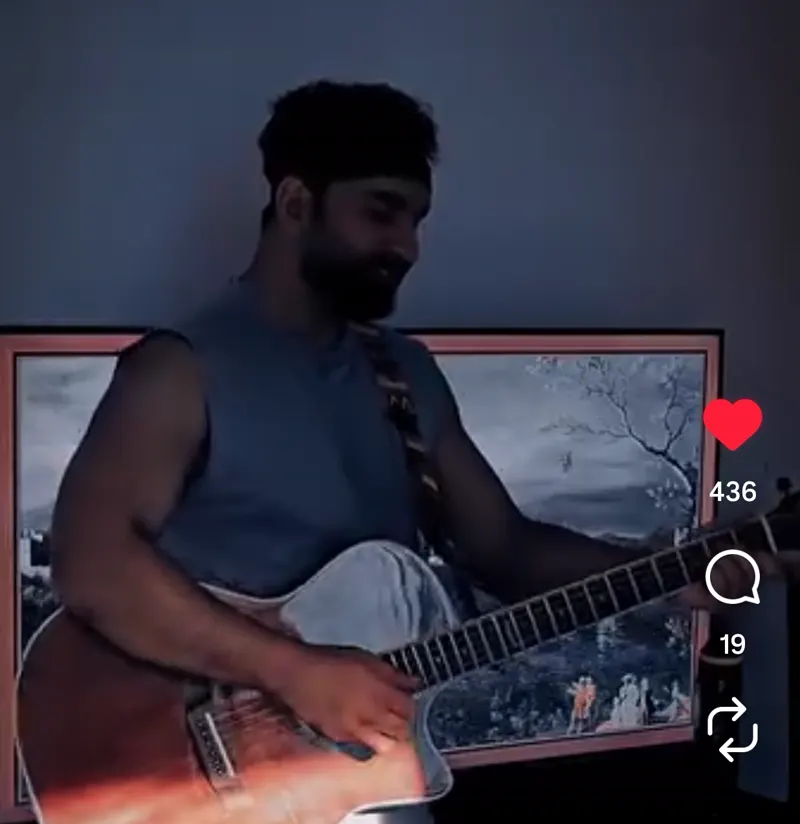 Aakash singing with guitar - reel two